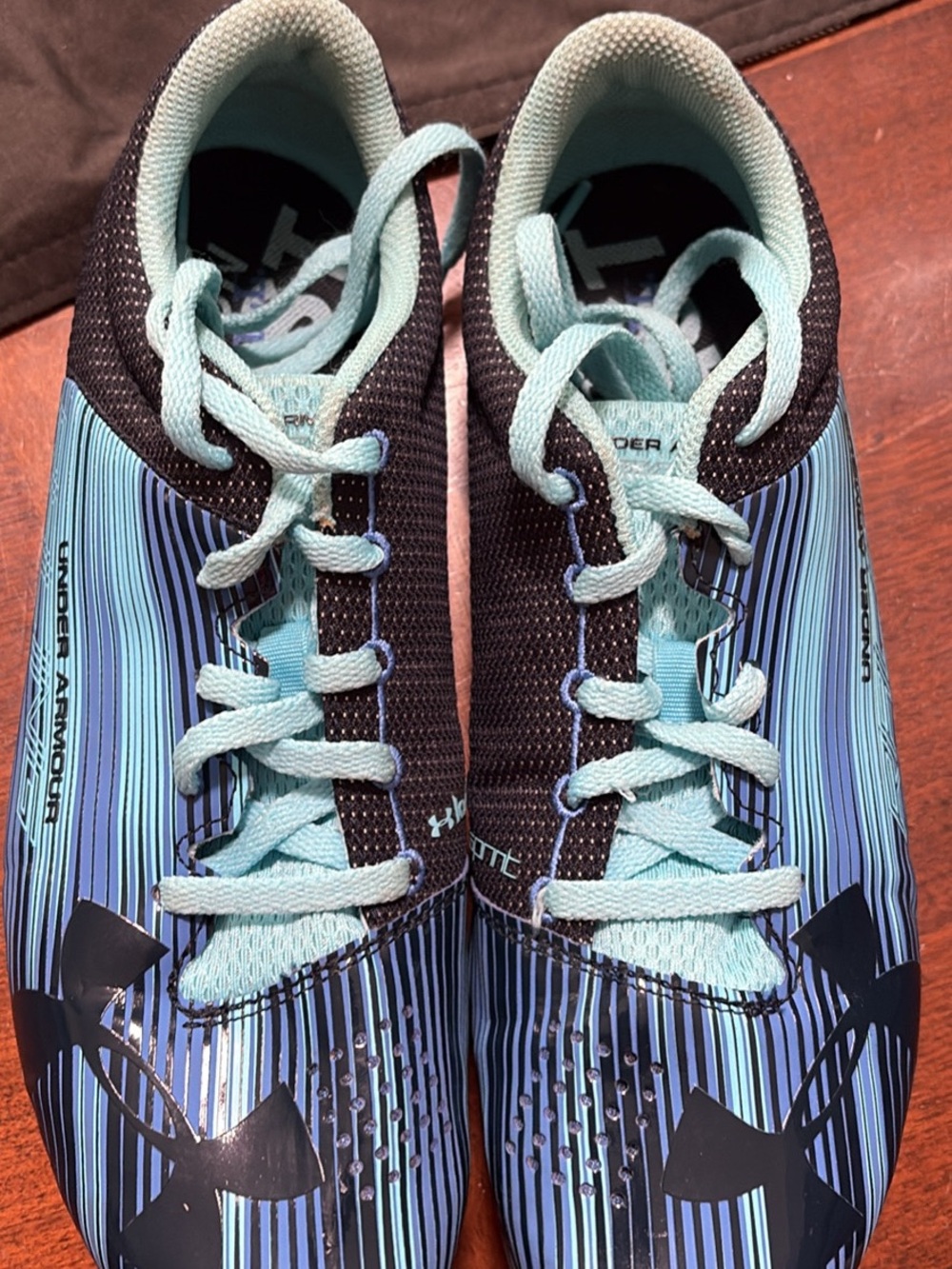 Under Armour Women’s Aqua and Black Track Cleats 9.5